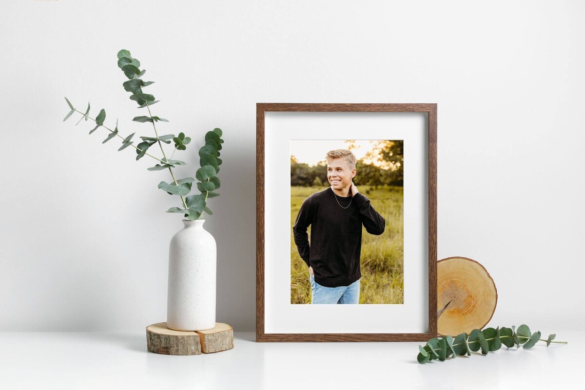 image of a framed print featuring a teen during his  senior photo session