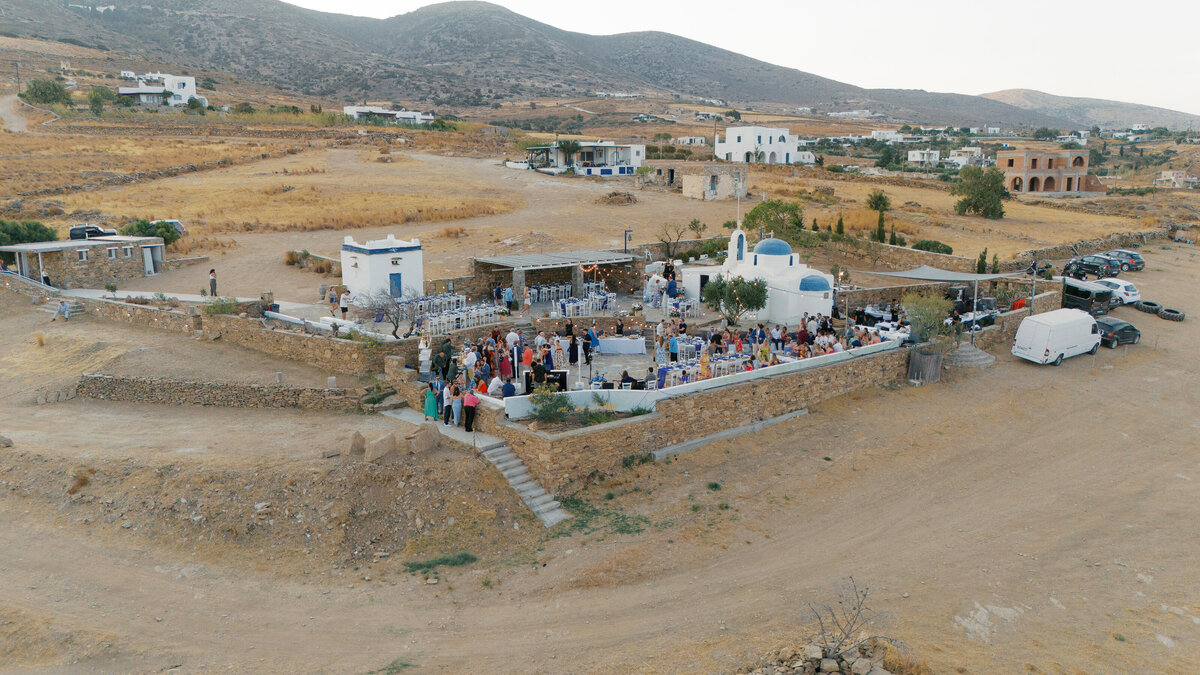 drone image of cocktail hour at a destination island wedding on Paros, Greece