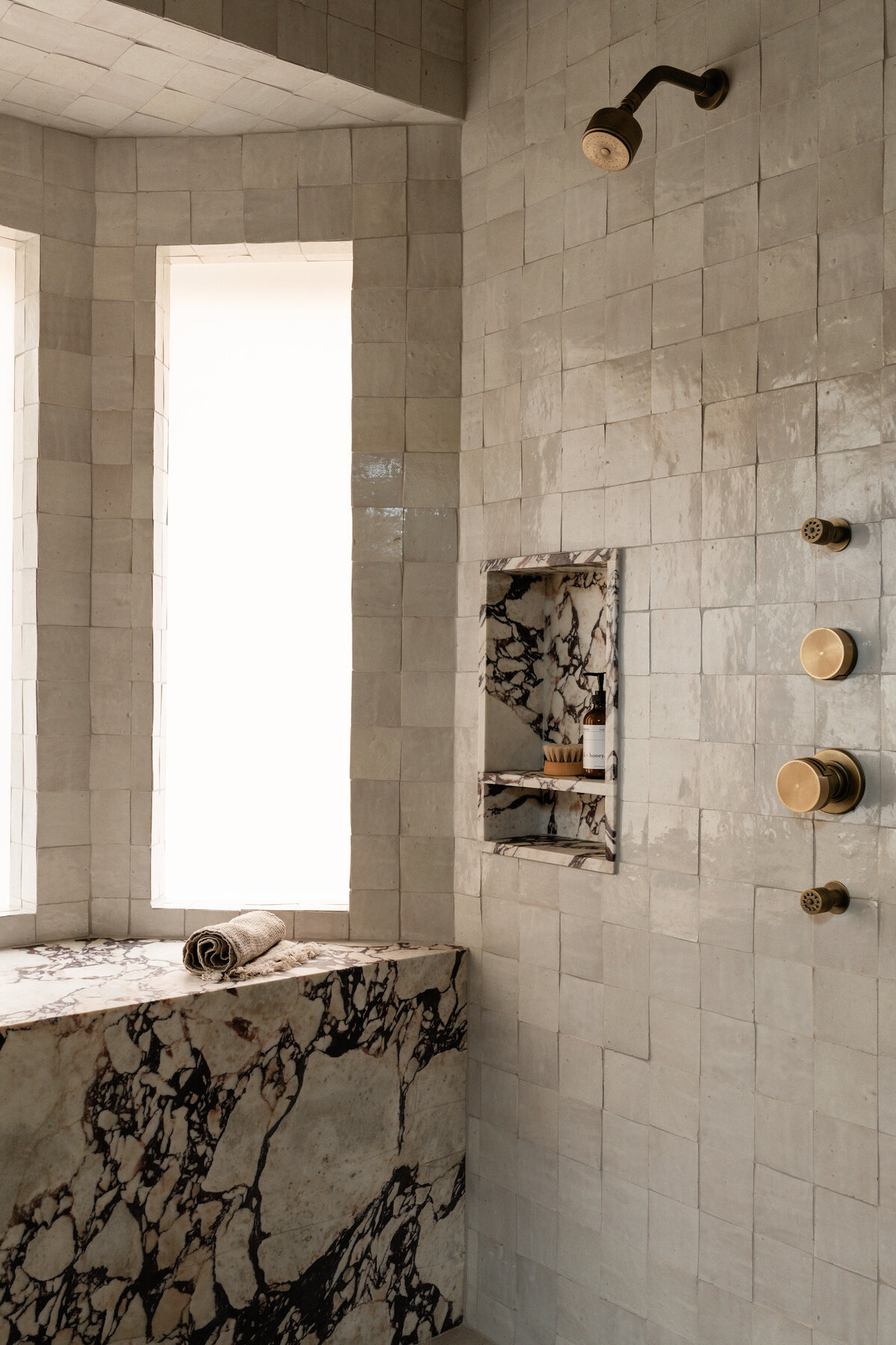 thousand-oaks-zellige-shower-viola-marble-bench-brass-fixture-serene-bathroom-design-austin-house-franc