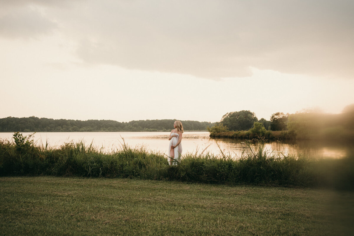 maternity photo with a lake in the background