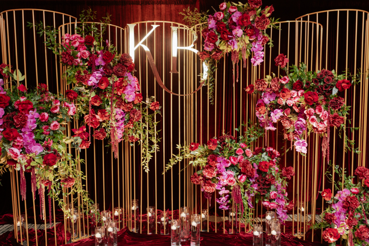 black-gold-pink-burgundy-wedding-reception-gold-frames-acrylic-logo-flowers