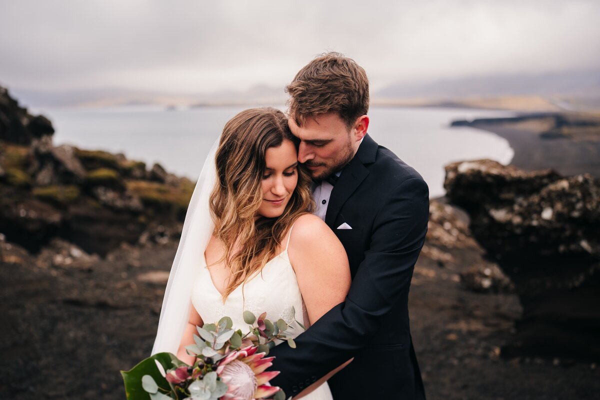 Couple shares an embrace during their Iceland elopement.