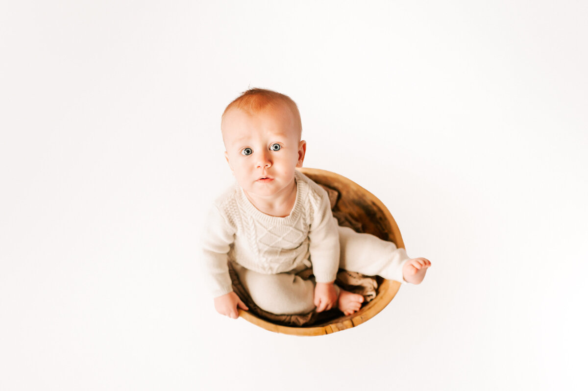 Springfield MO milestone and kids photographer Jessica kennedy of The XO Photography captures baby boy sitting in a bowl 