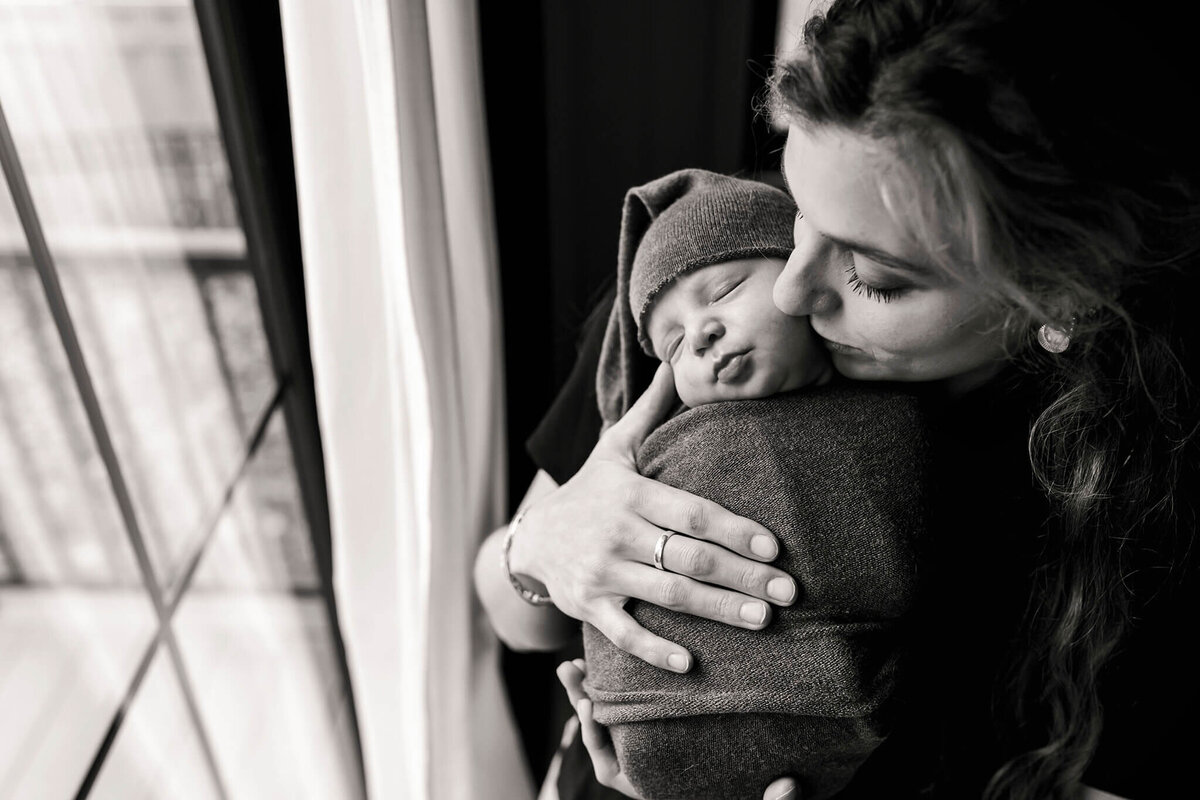 NJ newborn photographer captures mom holding her newborn close