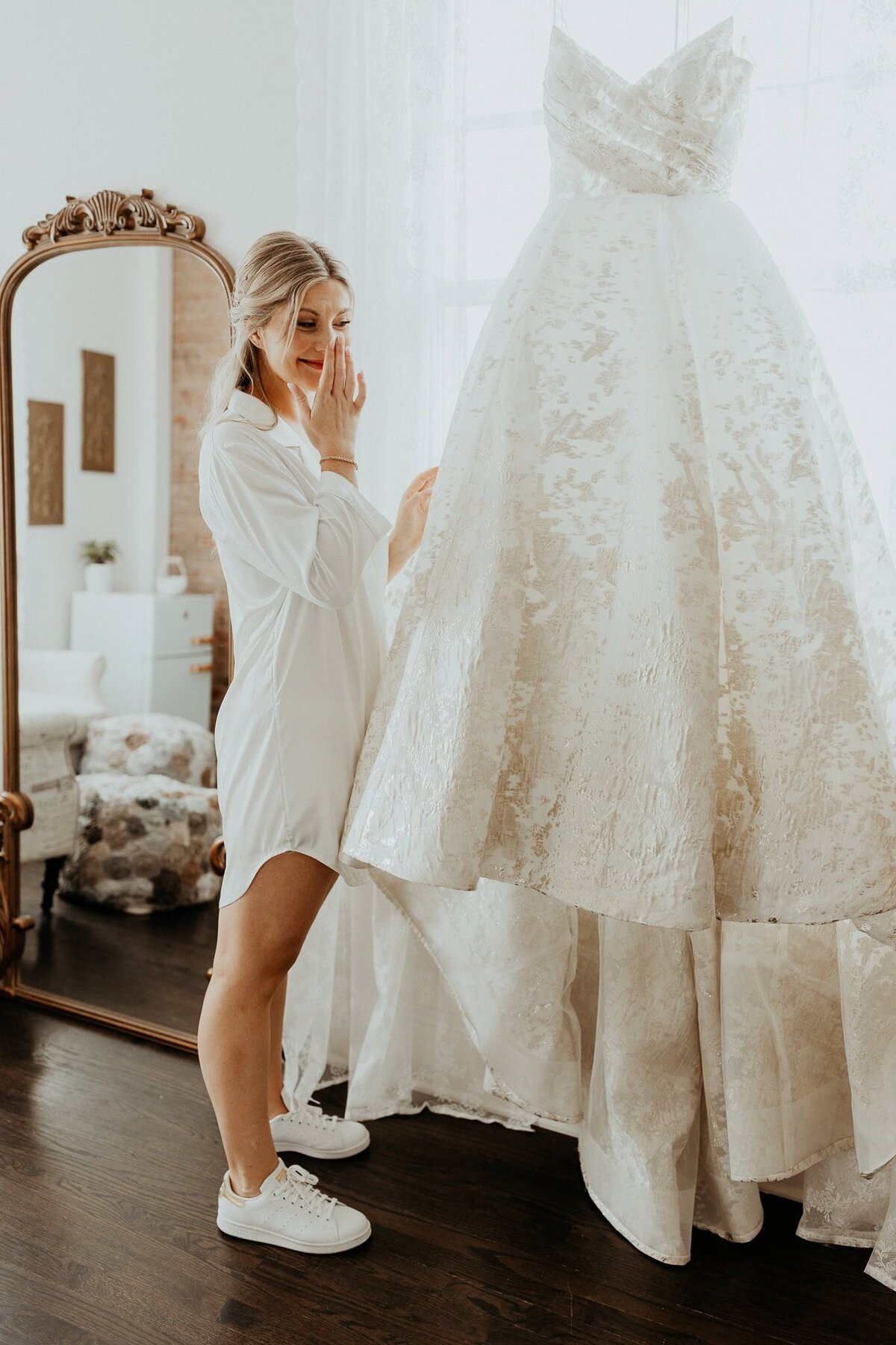 bride-looking-at-wedding-dress