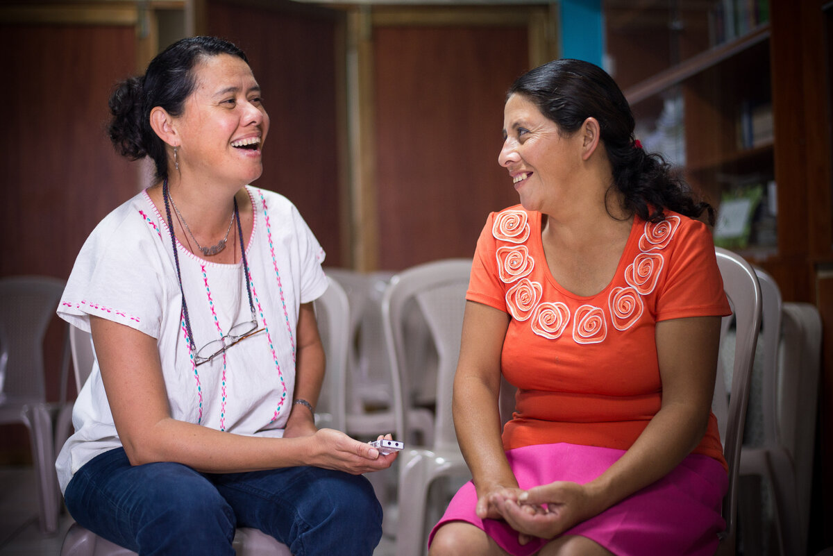 two women speak in nicragua
