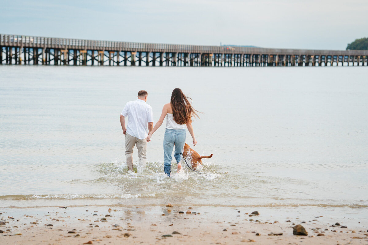 Duxbury MA engagement session featuring natural beach portraits and moments with the couple’s pup.