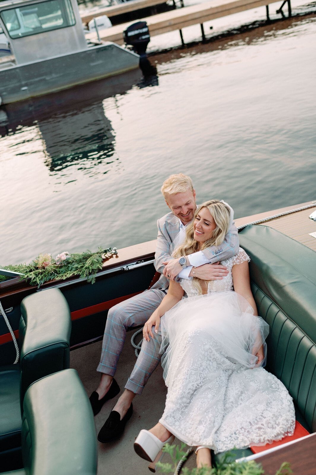 Bride and Groom Editorial Portrait on Luxury Wooden Boat Muskoka Lakes Golf and Country Resort Wedding Jacqueline James Photography