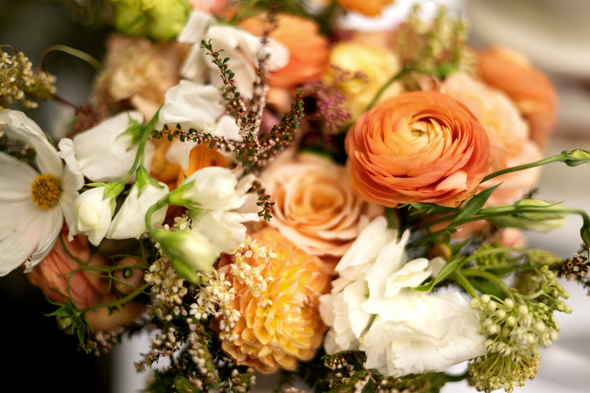 Peach and white wedding flowers photographed in natural light