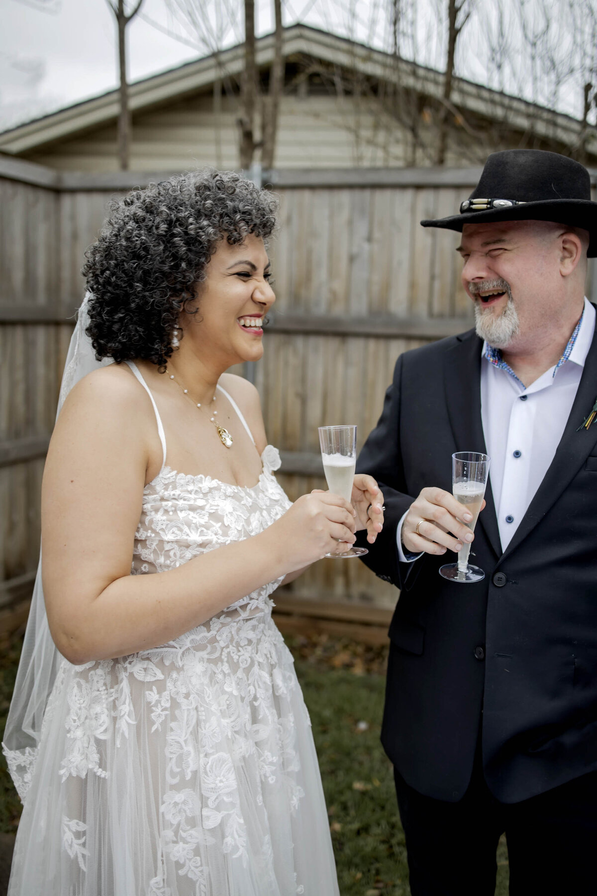 a dallas couple share a toast at their micro wedding