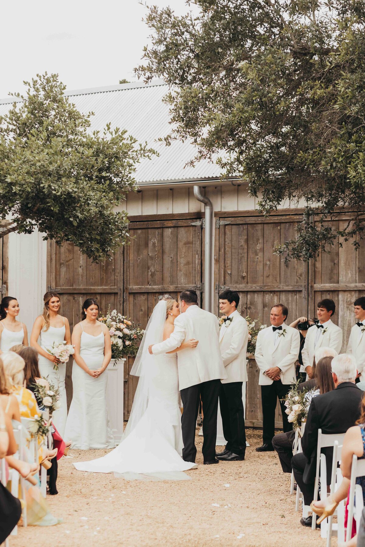 father hands off bride to groom