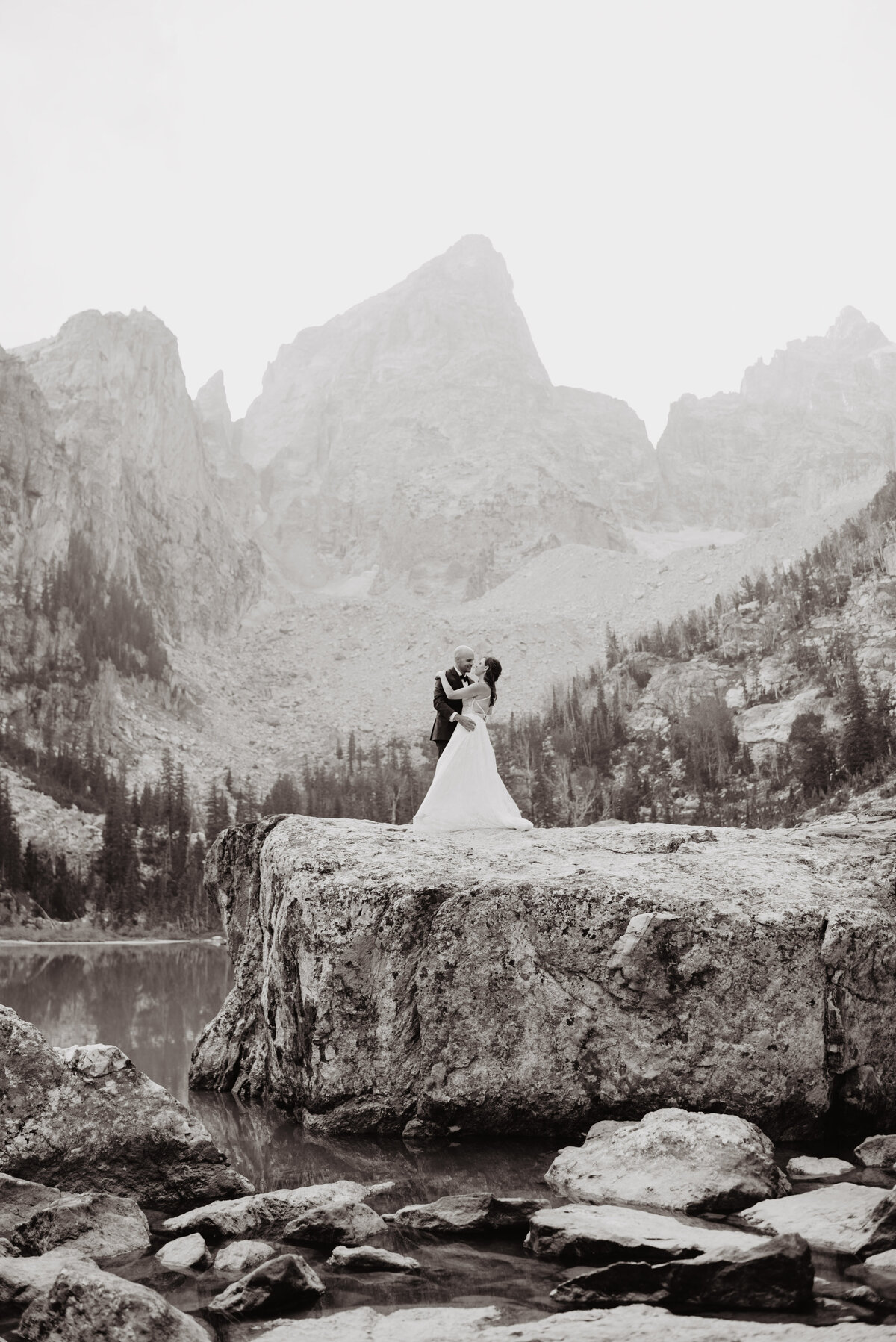 Jackson Hole photographers capture bride and groom hugging