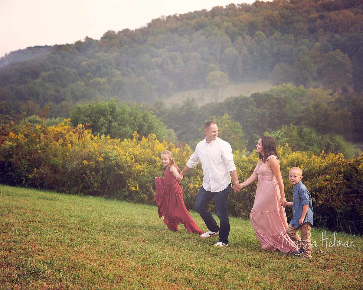 Irwin family walks together for their family portraits .