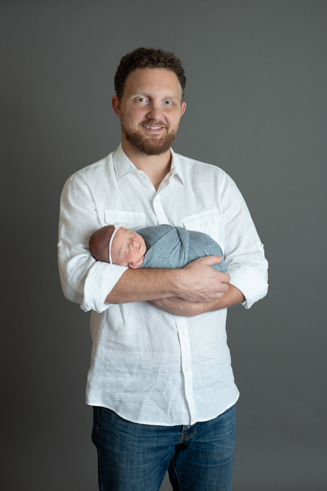 Newborn and Dad moment captured by Laura King Photography
