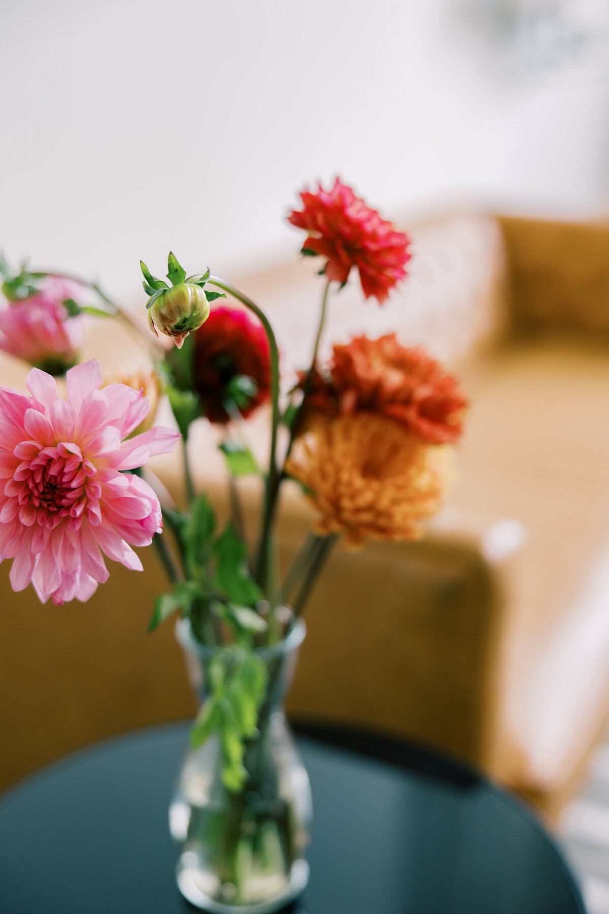 Bright bouquet of dahlias and seasonal blooms by Crimson & Clover styled for Sara’s Fetewell wedding.