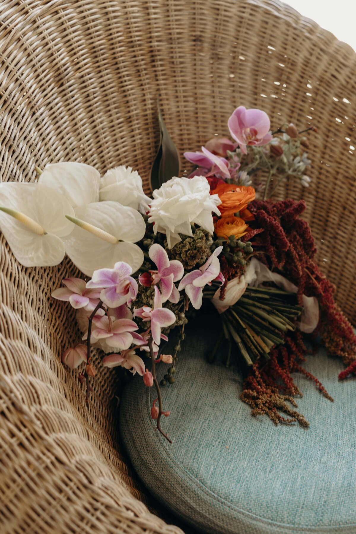 Wedding bouquet in Tulum sitting on a woven chair