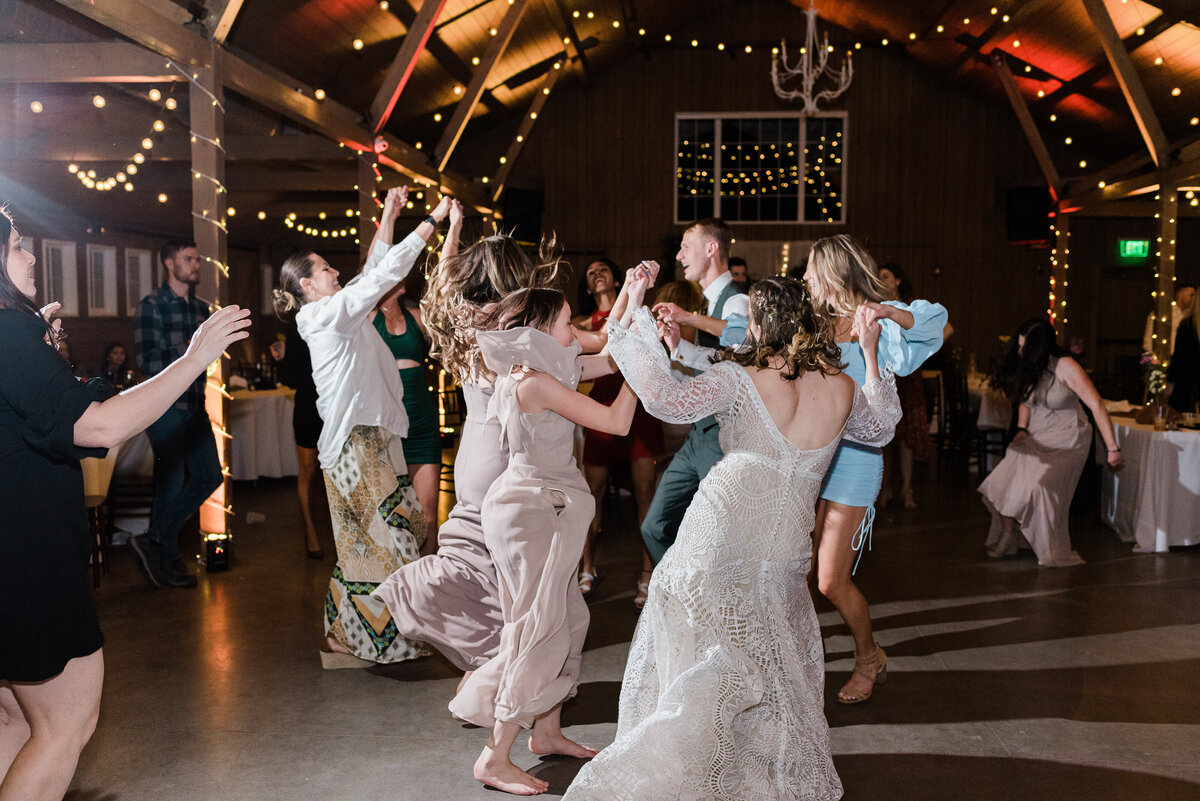 bride and groom dancing together during their night time reception at denver wedding venue captured by denver wedding photographer