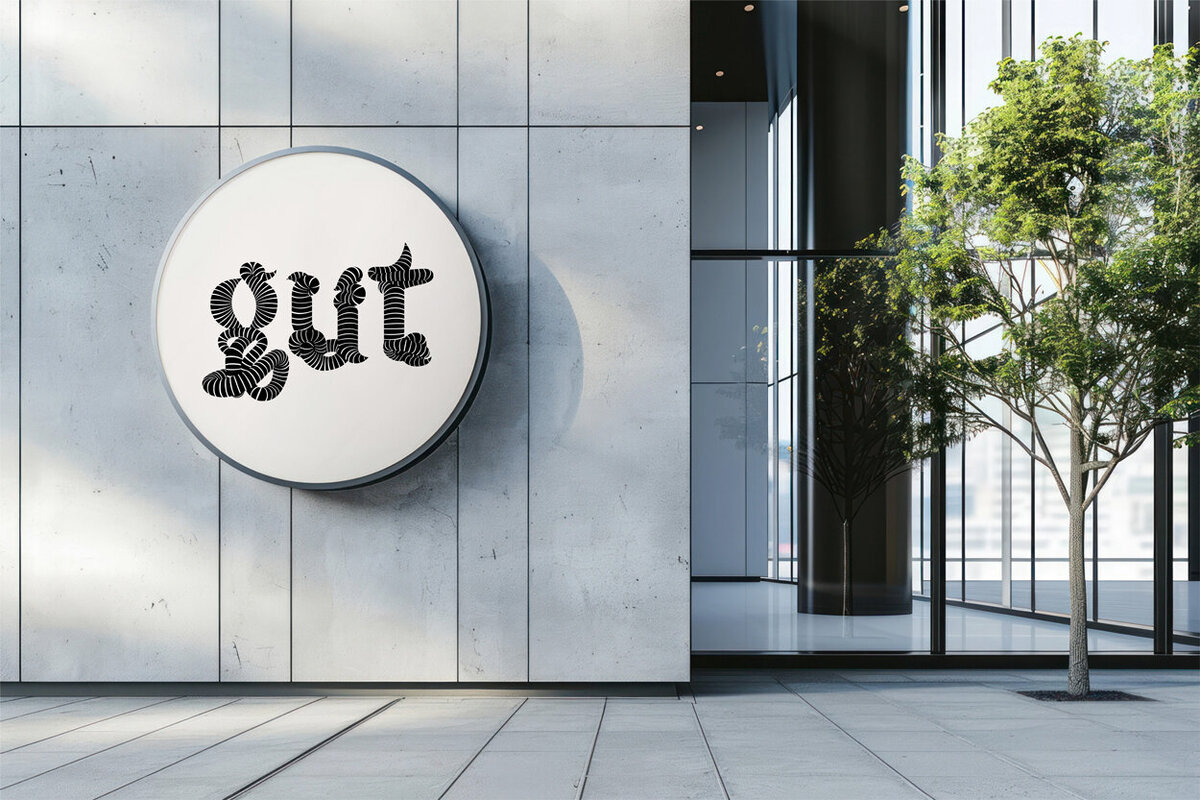 Exterior signage reading “gut” on a modern glass office building, reflecting the creative and culturally connected approach of Powell Communications, a B2B PR agency specializing in media relations, strategic communications, and digital PR strategy.