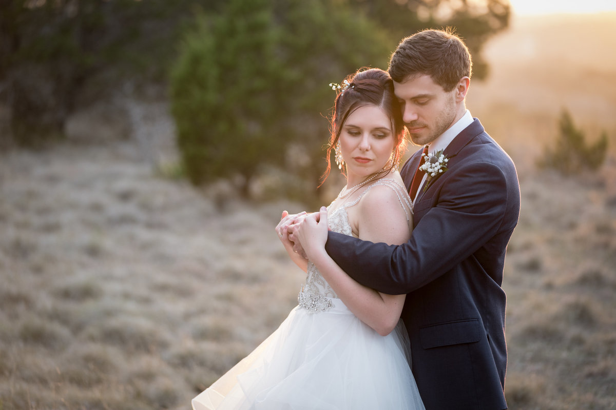 terrace club wedding photographer intimate sunset  bride groom hug natural light 600 US-290, Dripping Springs, TX 78620