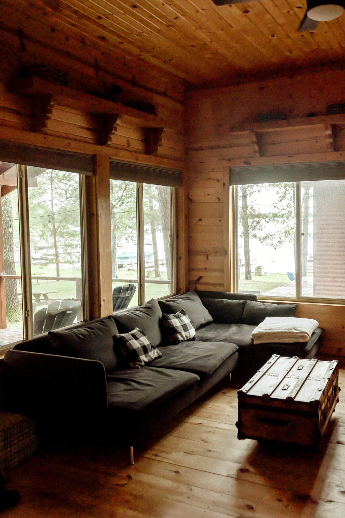 log cabin living room overlooking lake