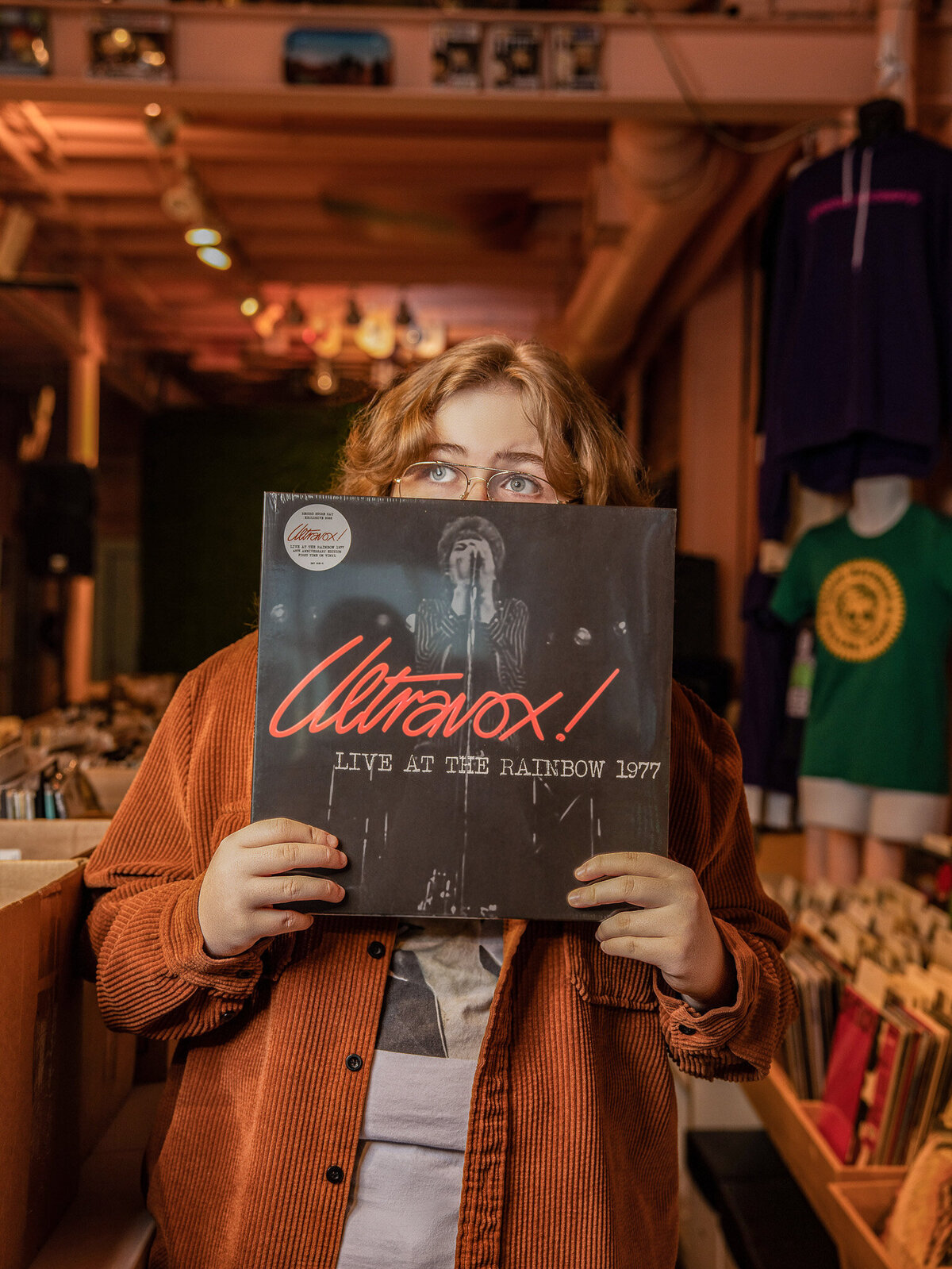 a girl holding up a record