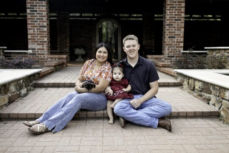 The family sharing laughter and love, posing naturally for their photoshoot, creating memories that will last a lifetime