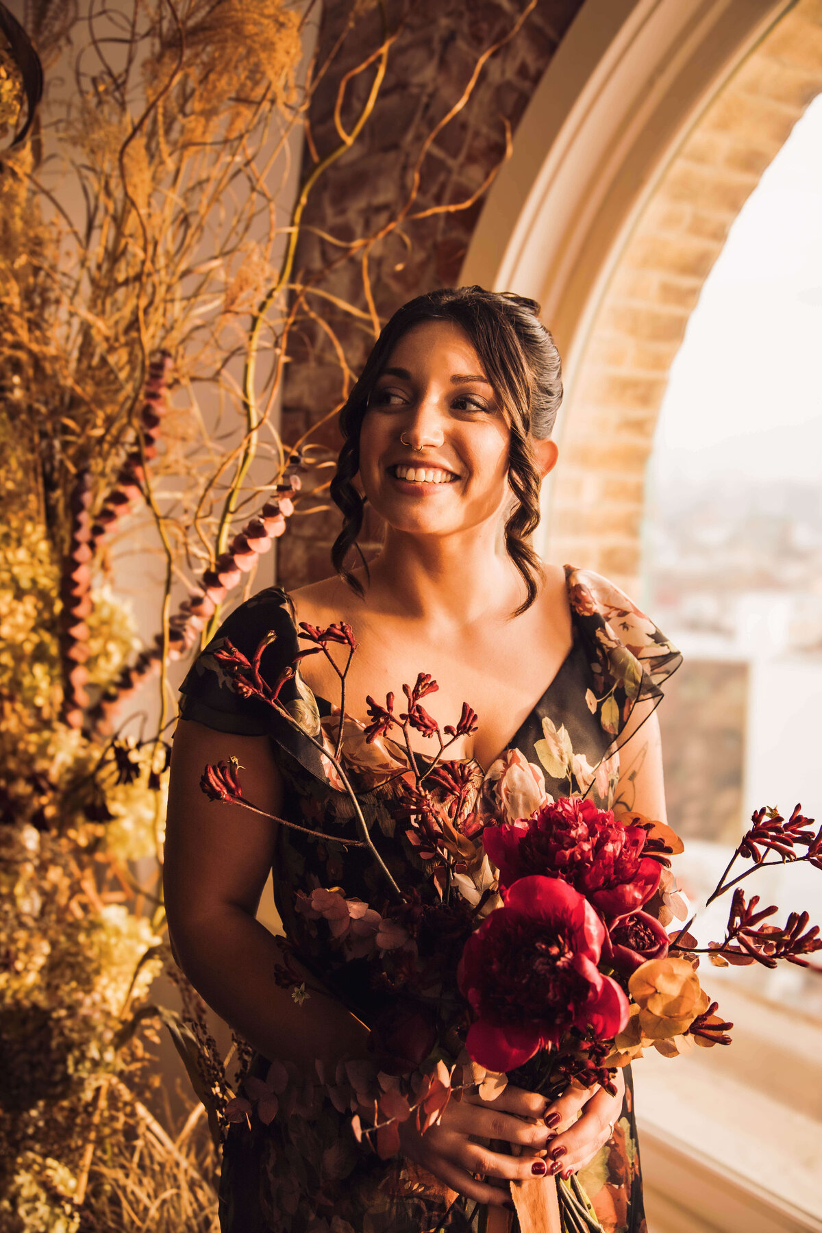 Bride holding a red flower bouquet for her Philadelphia wedding