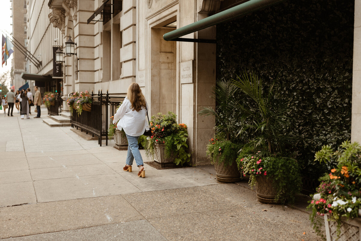 Lydon (web designer) walking on the sidewalk in the city