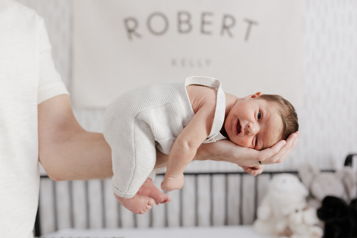 Indianapolis newborn photography baby in crib portrait