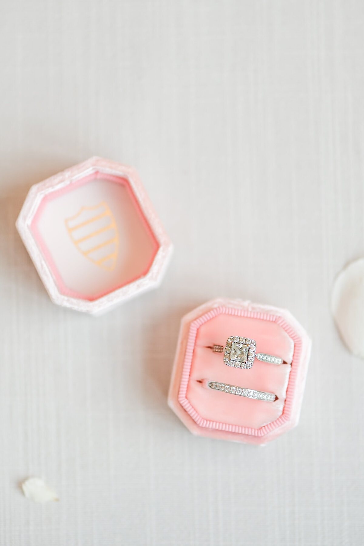 blush pink mrs box and wedding rings on wedding day