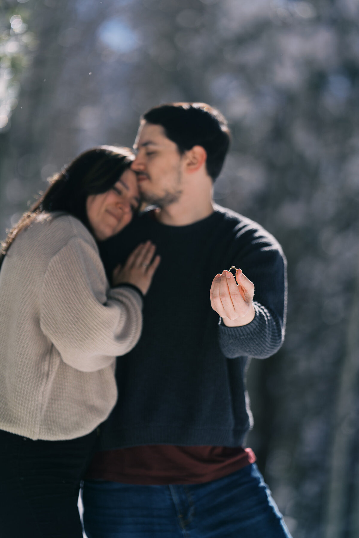 engaged-couple-ring-snuggle