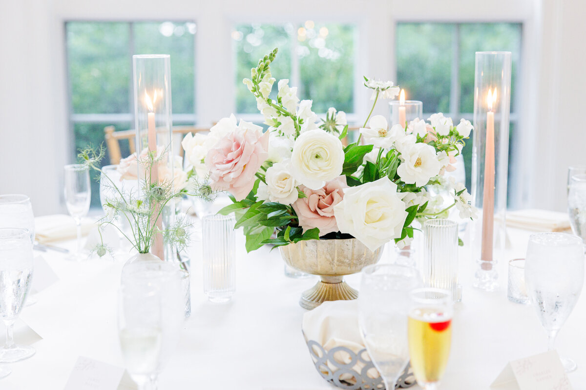Close up of white and blush floral centerpiece representing Christine Hazel Photography's attention to detail.