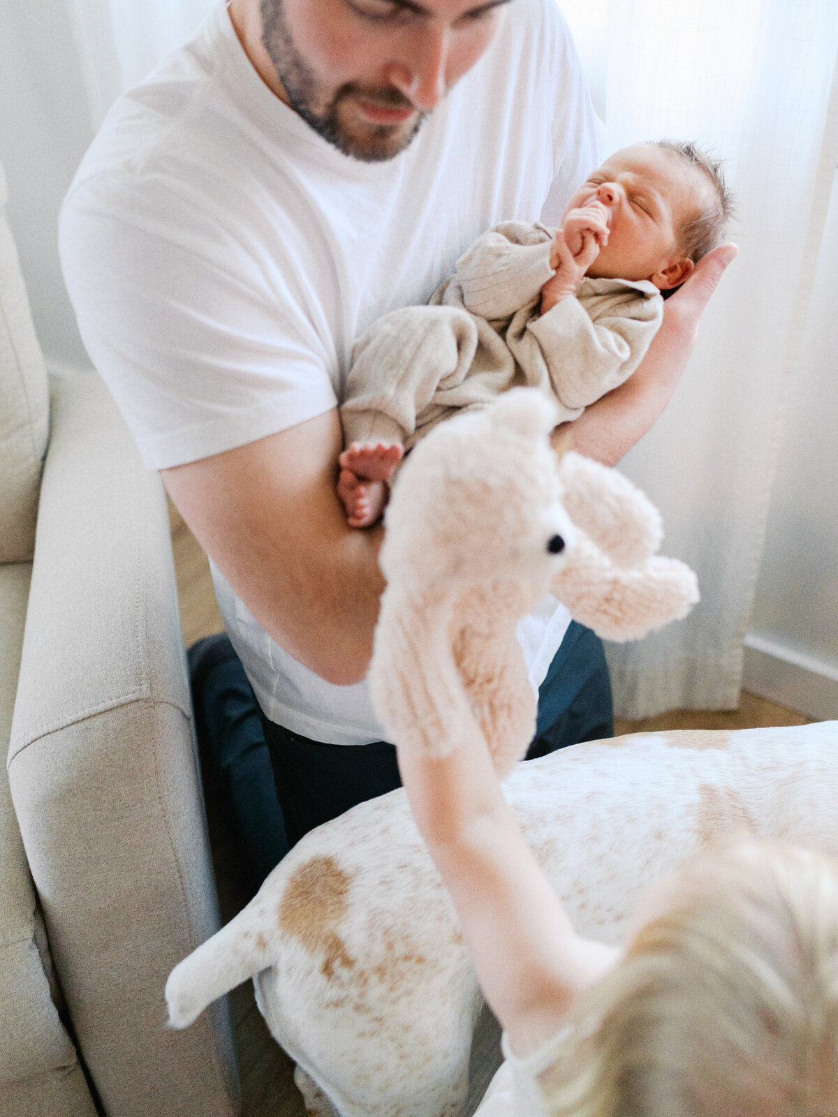 sister-giving-bear-to-baby