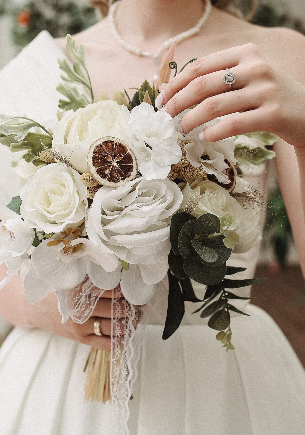 Woman in White Wedding Dress Holding Bridal Bouquet