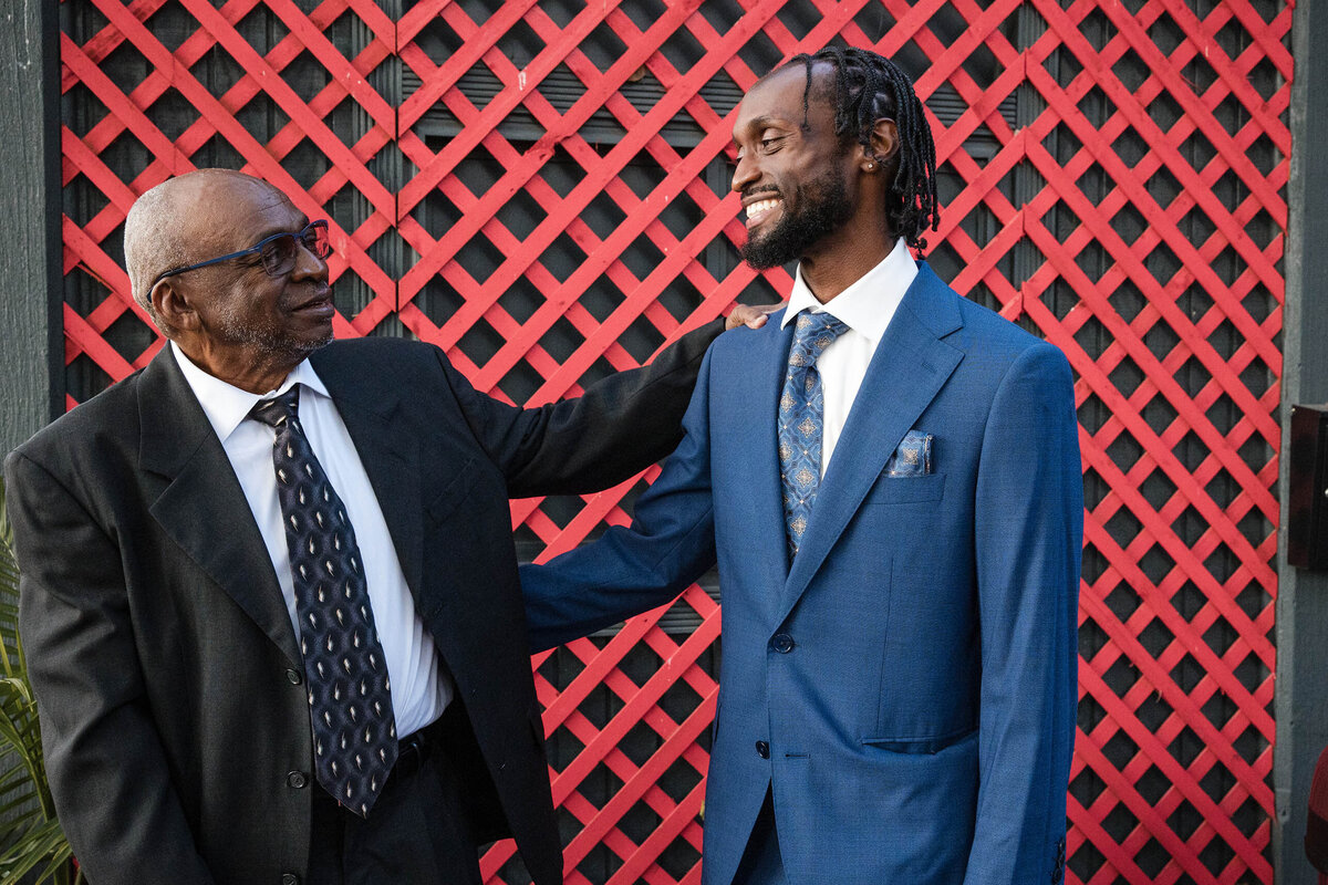 groom's-father-congratulating-son