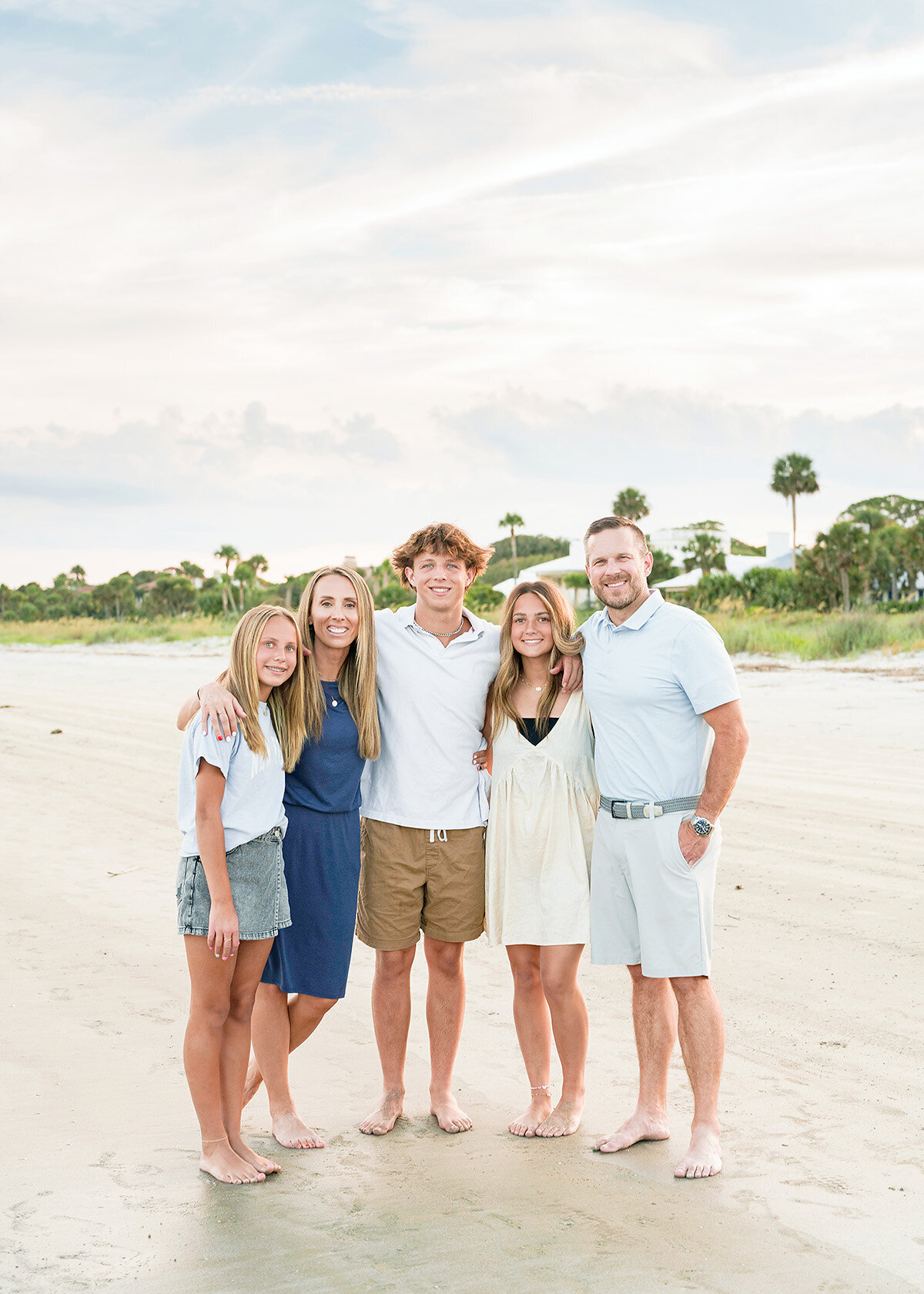 family of 5 photographed on the beautiful beaches of sea island at sunset.
