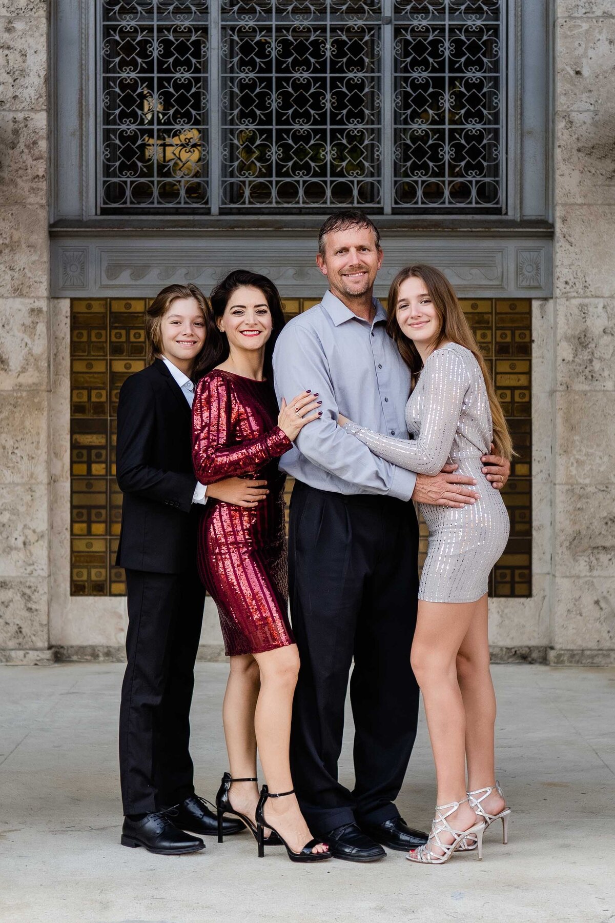 A family in front of Fort Myers Florida Sidney & Berne Davis Art Center in Fort Myers Florida