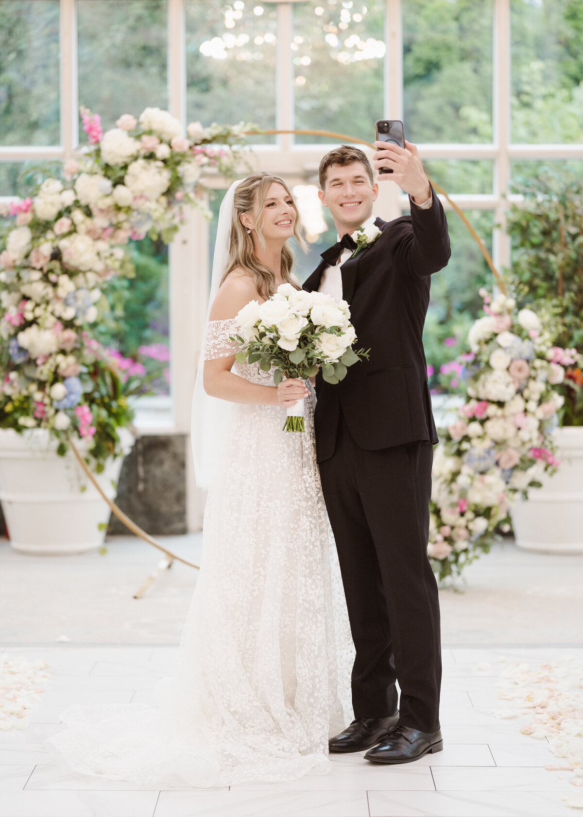 bride and groom portraits in the madison hotel conservatory venue nj