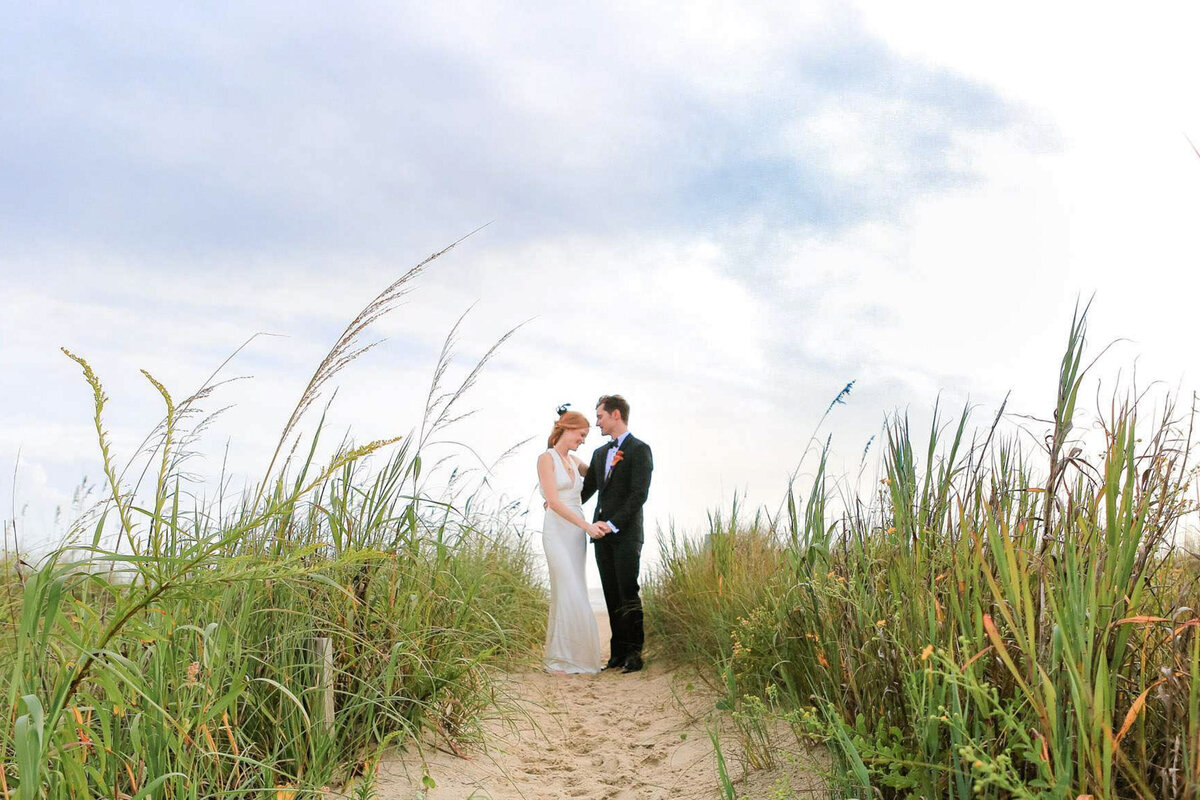 "Married couple embracing on Wrightsville Beach"