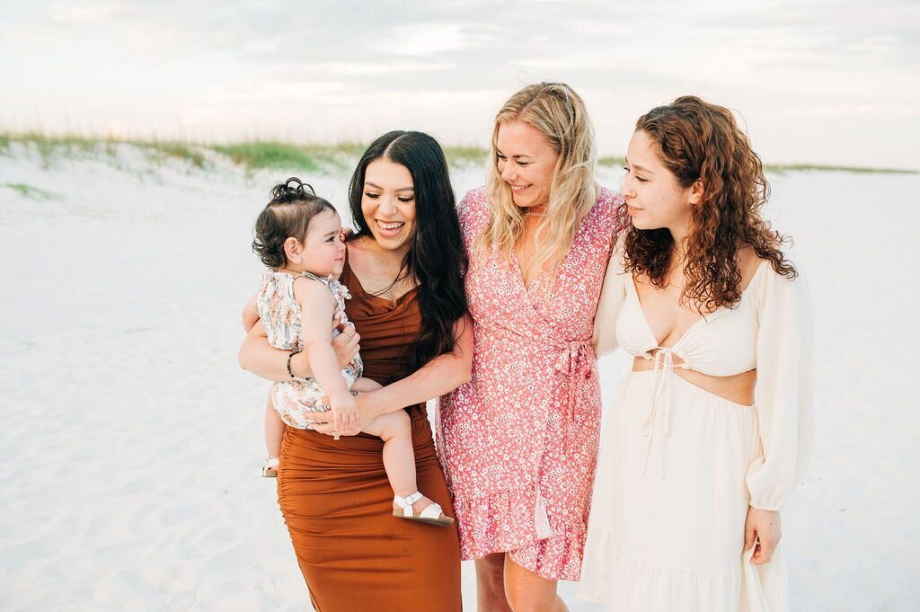 girls looking at baby at Portofino Resort, Pensacola Beach