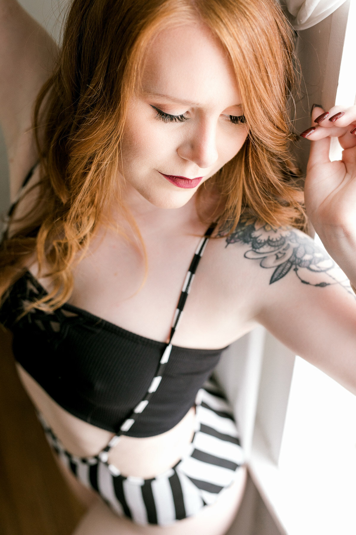 woman wearing black and white boudoir jumpsuit