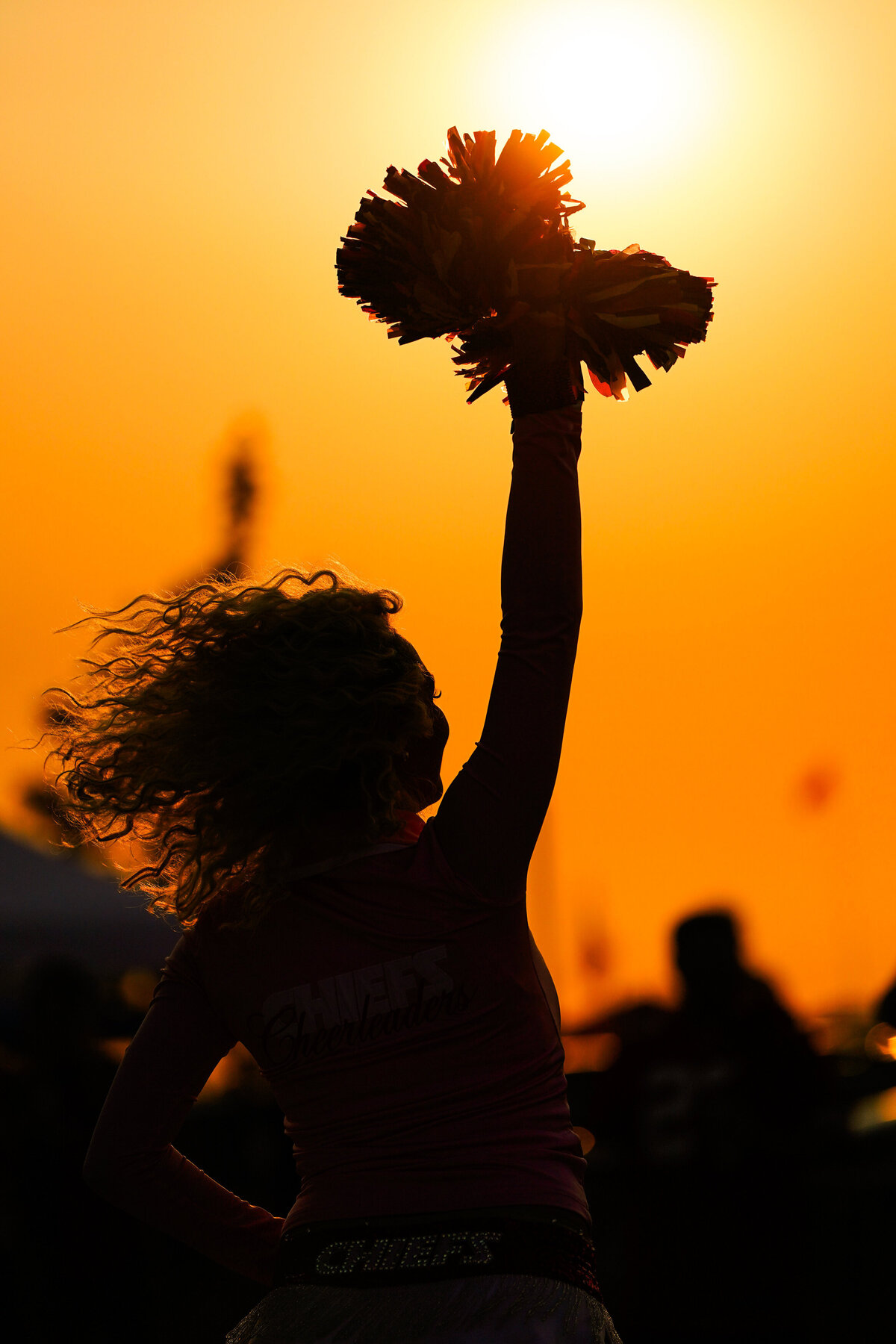 kansas-city-sports-photography-chiefs-0033-cheerleader-sunset-silhouette