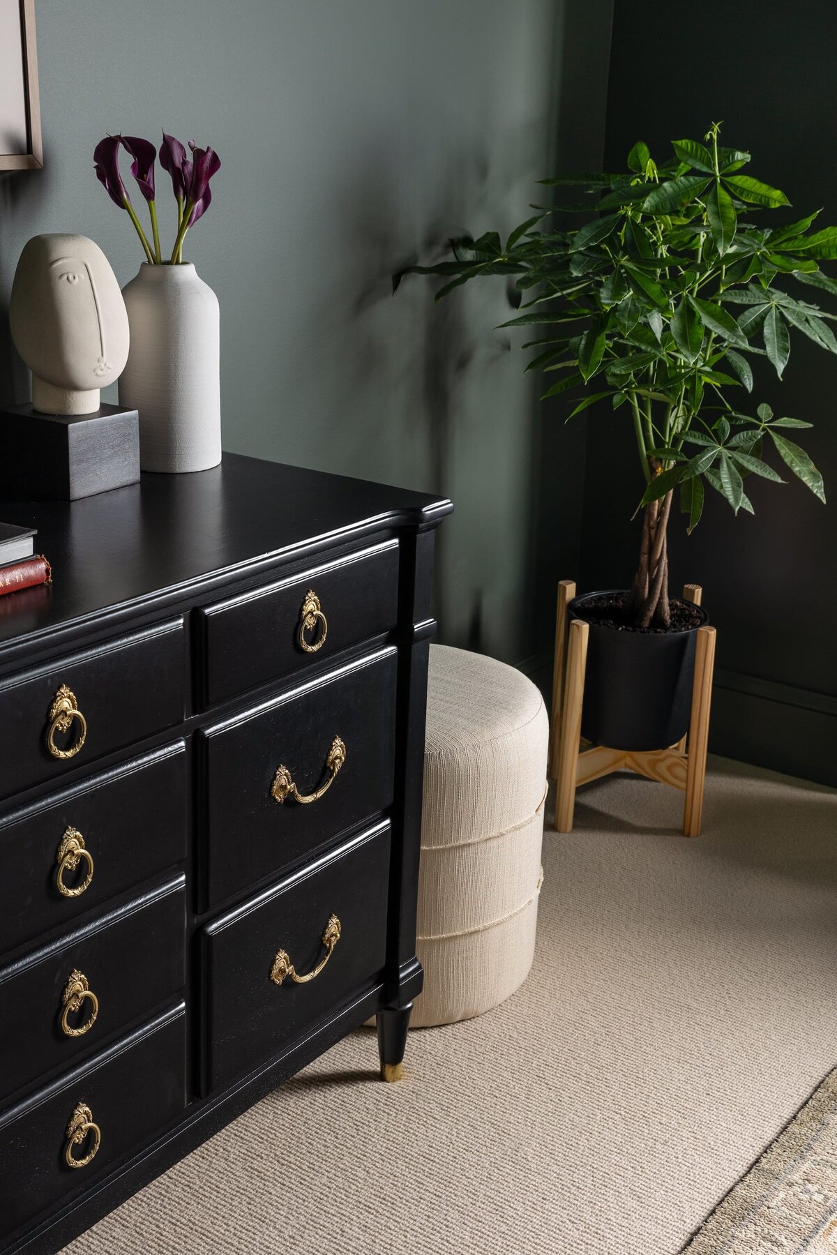 melinda chesson interiors murrayhill road black dresser with gold handles and green plant
