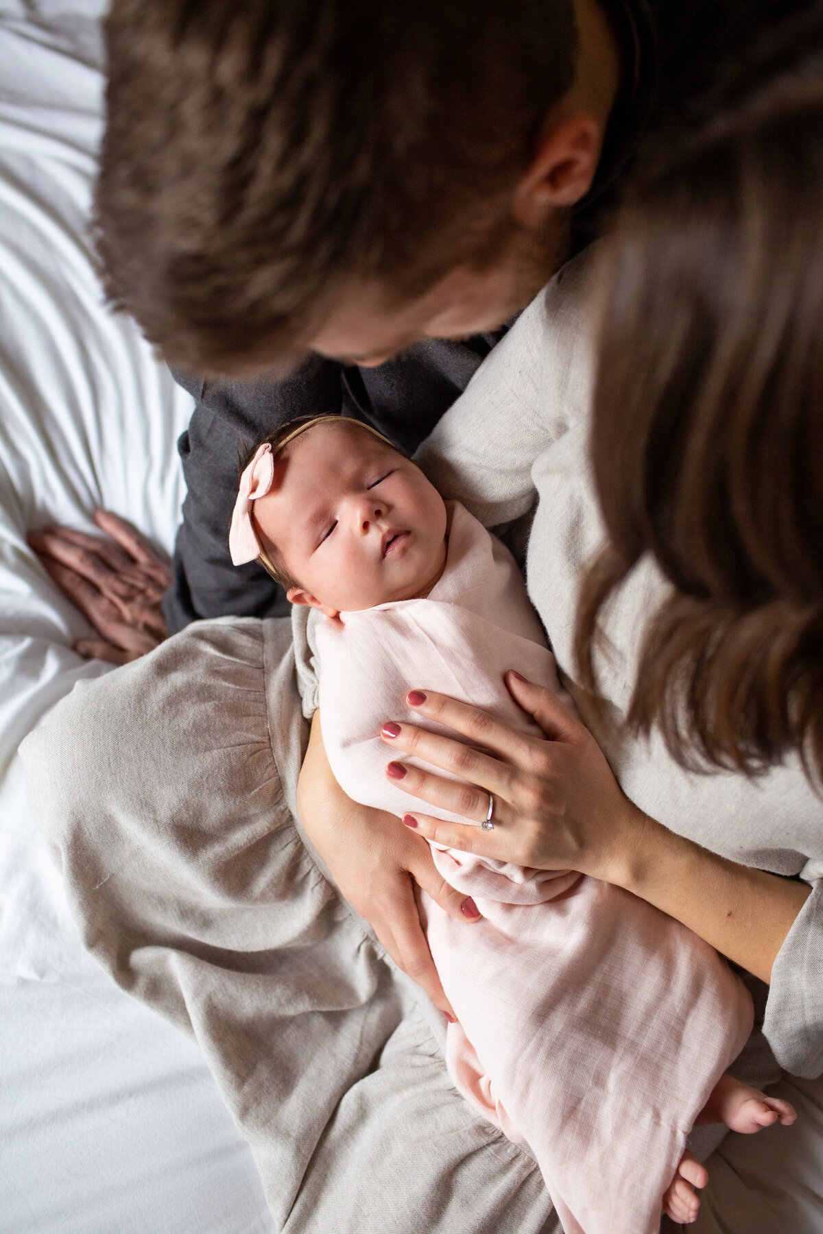 Family portrait at an in-home lifestyle newborn photoshoot.