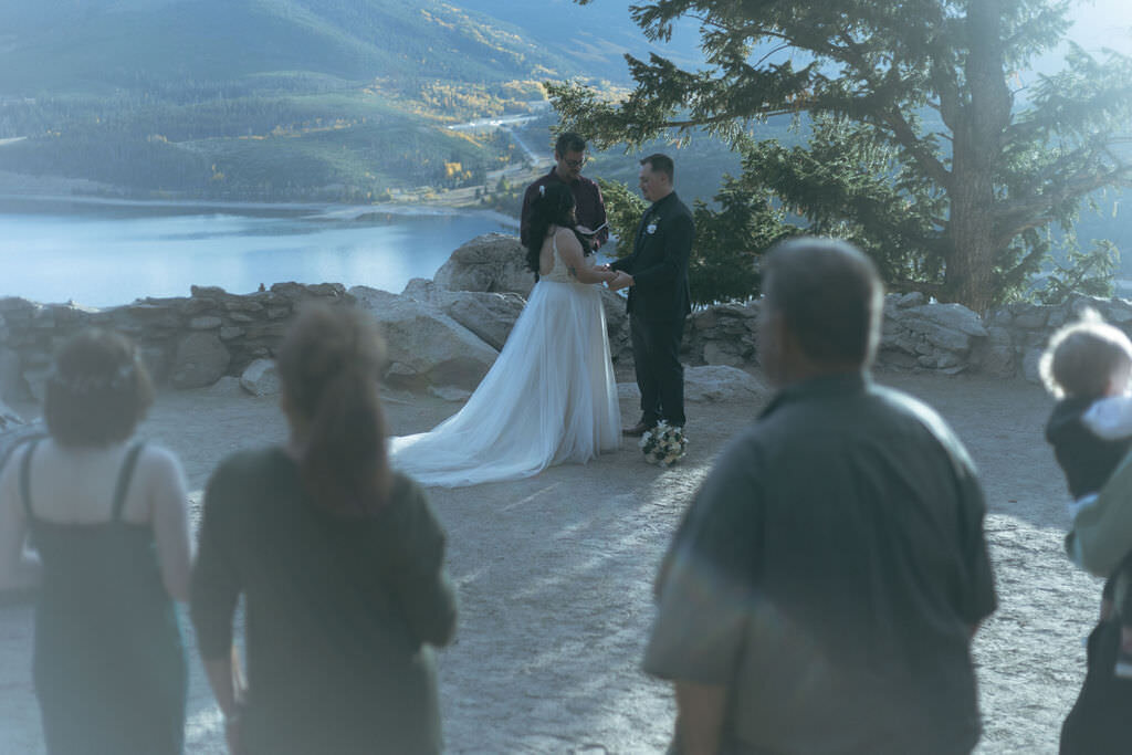 A wedding ceremony overlooking a lake.