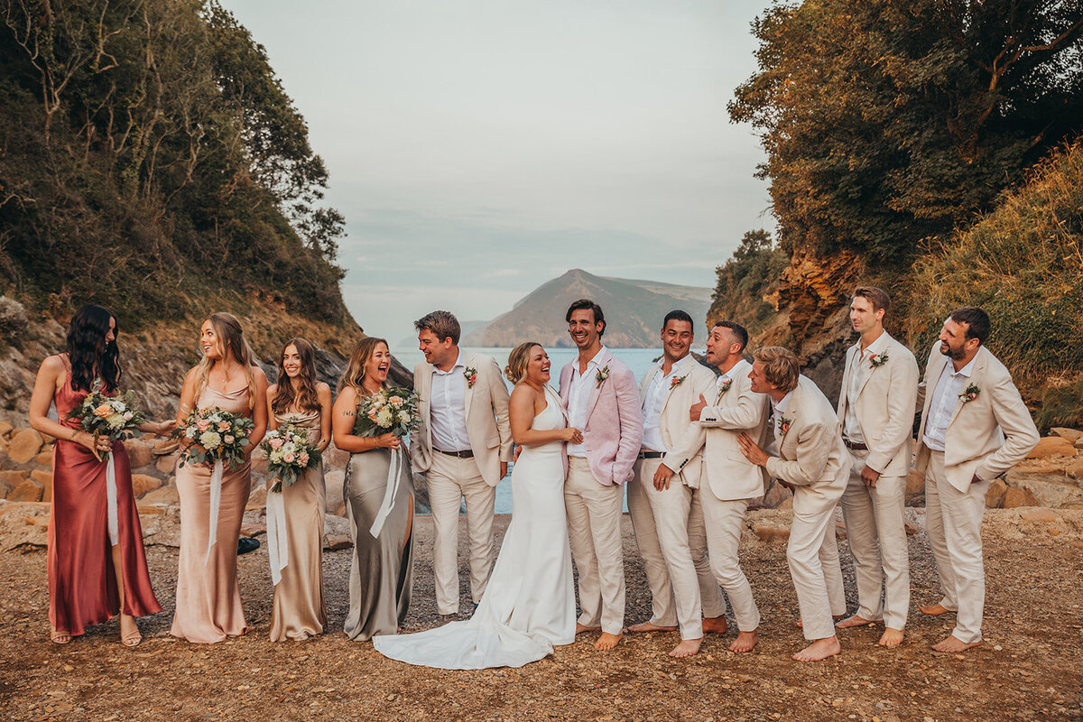 wedding party all pose together