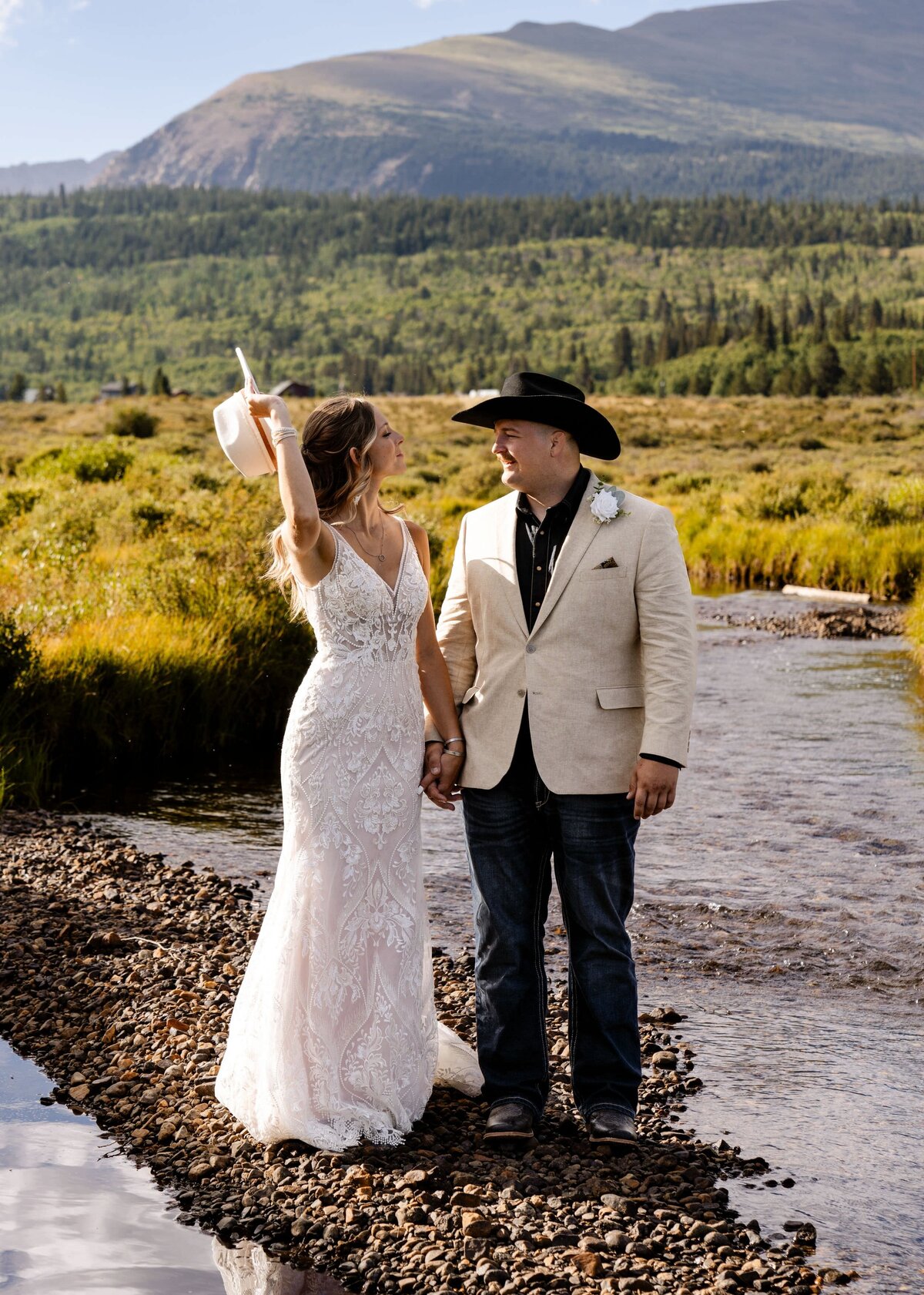 denver colorado wedding photographer - mountains behind bride and groom
