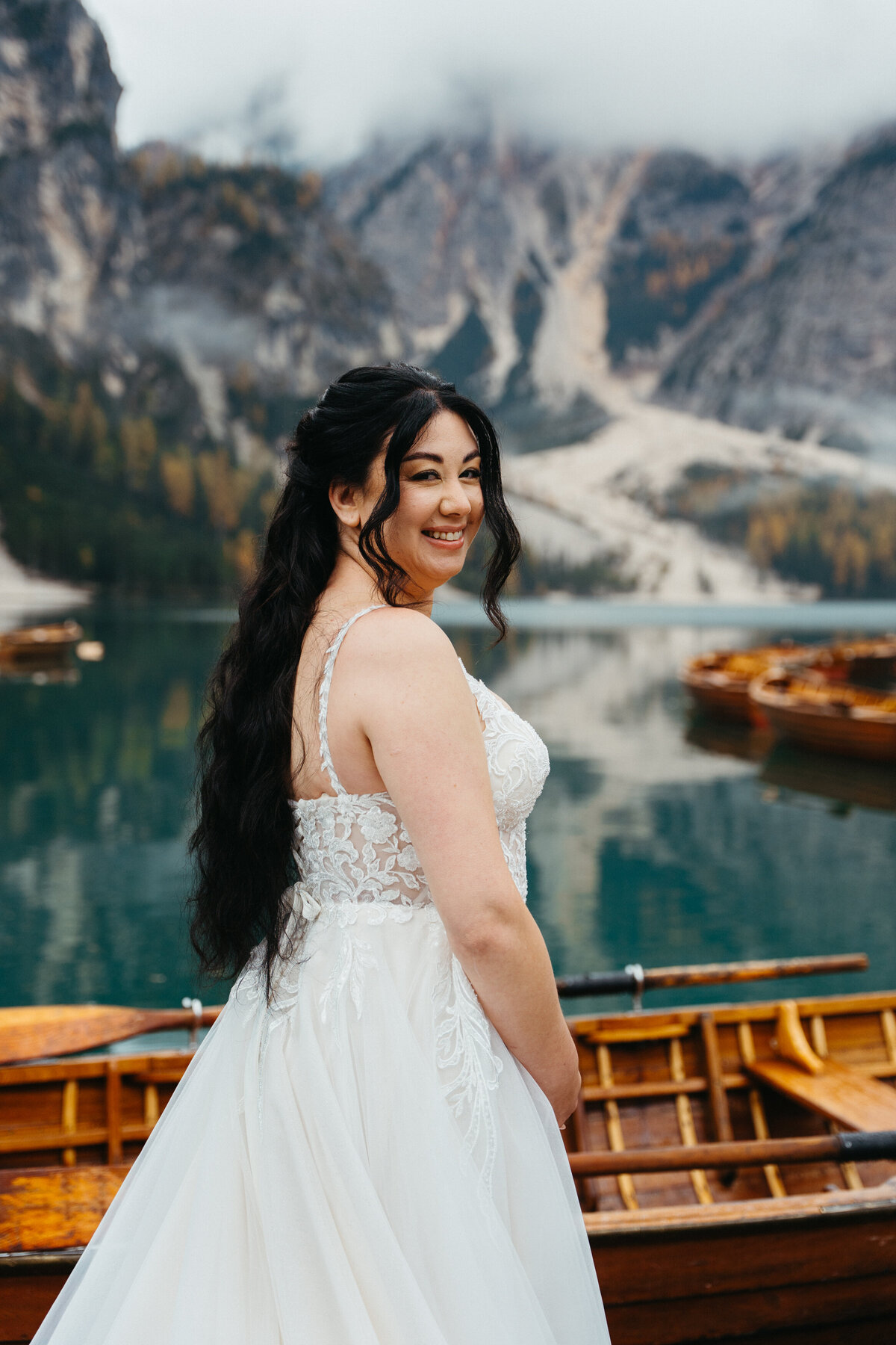 Lago di Braies sunrise elopement bride on La Palifitta dock