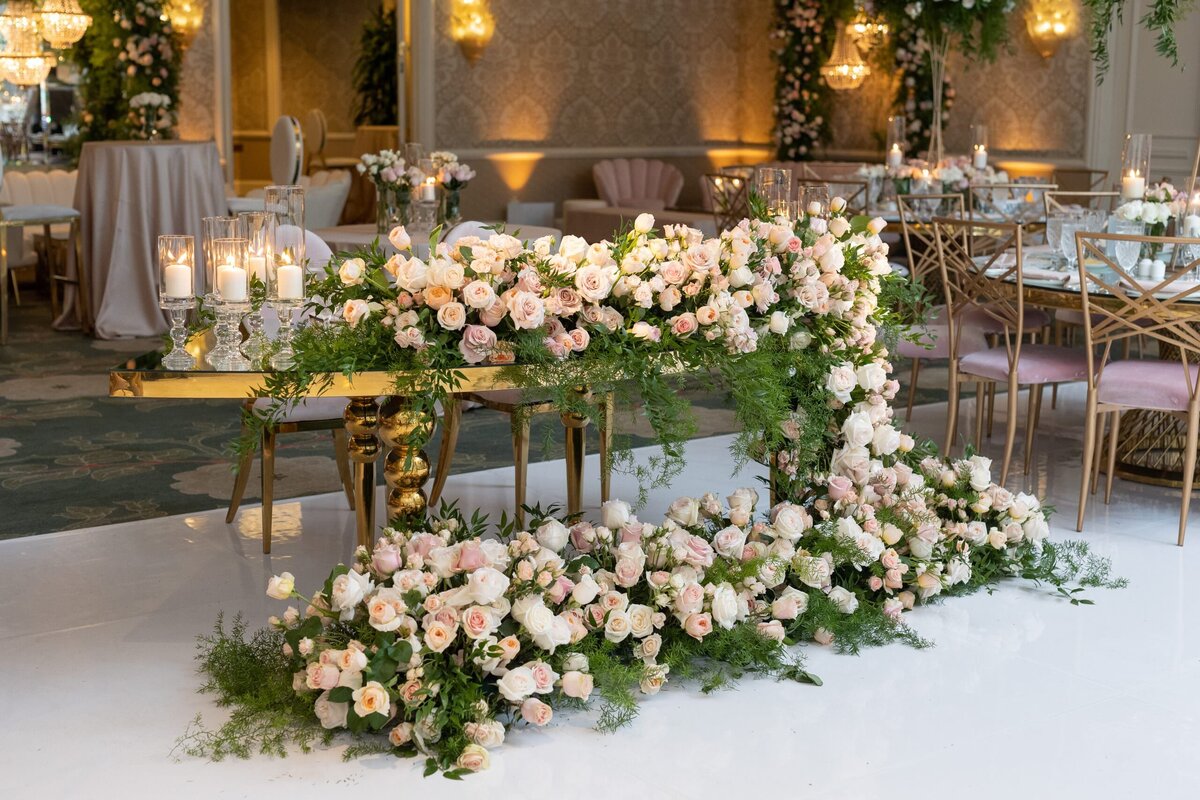 A flower arrangement laid out on a table