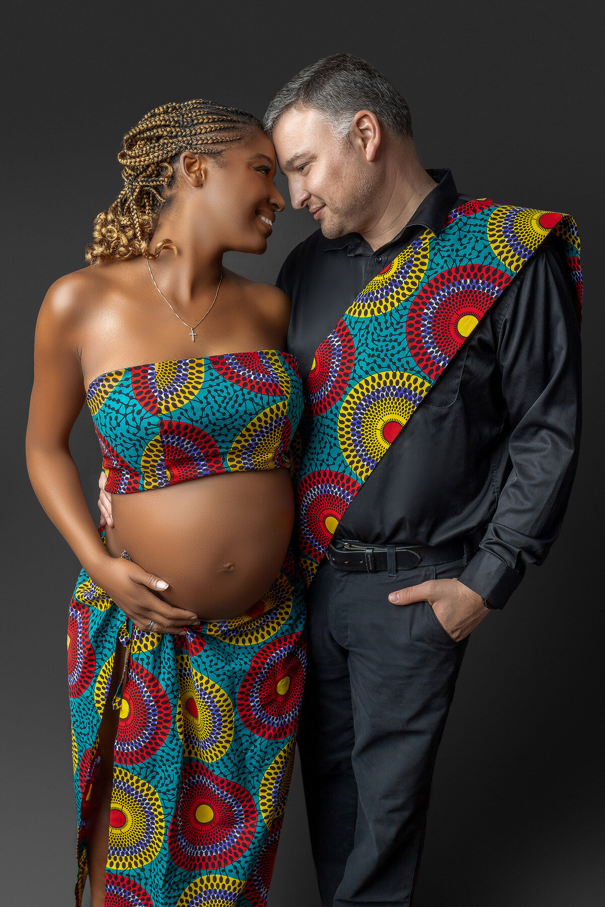 beautiful maternity photography image taken in Hamilton Studio showcasing african cultural outfits